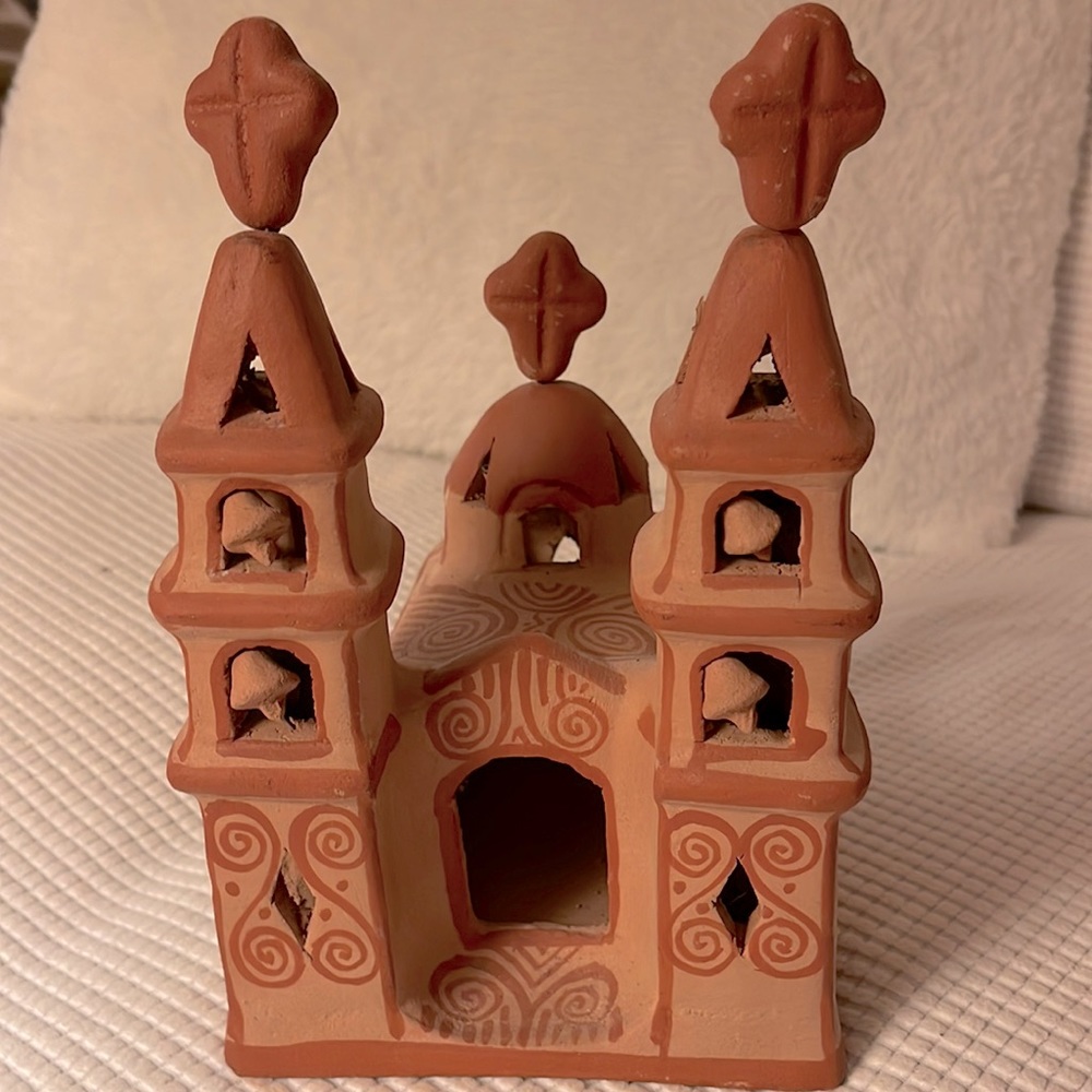 Red clay ceramic church with two towers, bells and crosses. Beautiful piece